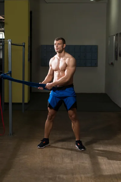 Handsome Guy Working Out With Rubber Band — Stock Photo, Image