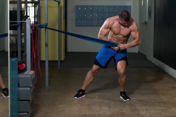 Handsome Guy Working Out With Rubber Band — Stock Photo, Image