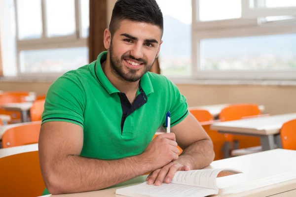 Arabic Student With Books Sitting In Classroom — Stock Photo, Image