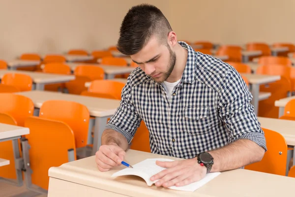 Student With Books Sitting In Classroom — Stock Photo, Image