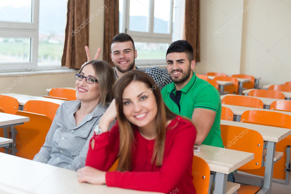 Group Of Young Students Preparing For Exams