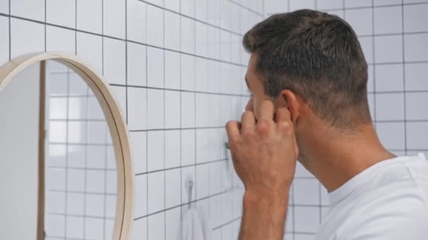 Man Cleaning Ears Cotton Swab Bathroom — Stock Video