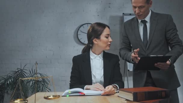 Lawyer Giving Clipboard Colleague Working Table Office — Stock Video