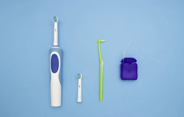 Oral Hygiene Electric Toothbrush Brush Toothbrush Dental Floss Blue Background — Stock Photo, Image