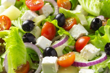 Greek salad, close up. Background of vegetable salad. Healthy vegetarian food.