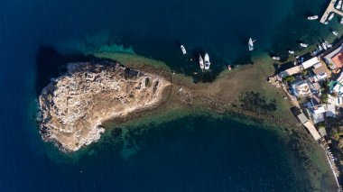 Breathtaking View of Gumusluk Bay with Yachts and Nearby Greek Islands