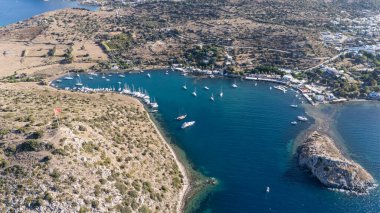 Breathtaking View of Gumusluk Bay with Yachts and Nearby Greek Islands