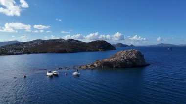 Breathtaking View of Gumusluk Bay with Yachts and Nearby Greek Islands