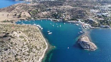 Breathtaking View of Gumusluk Bay with Yachts and Nearby Greek Islands
