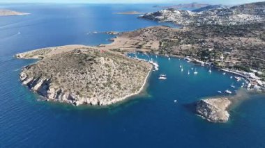 Breathtaking View of Gumusluk Bay with Yachts and Nearby Greek Islands