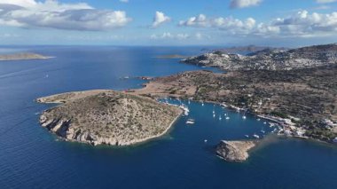 Breathtaking View of Gumusluk Bay with Yachts and Nearby Greek Islands