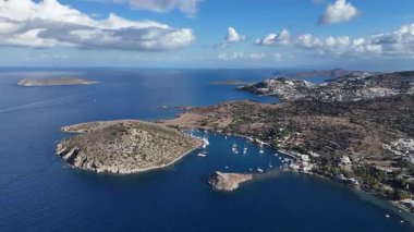 Breathtaking View of Gumusluk Bay with Yachts and Nearby Greek Islands