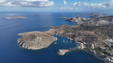 Breathtaking View of Gumusluk Bay with Yachts and Nearby Greek Islands