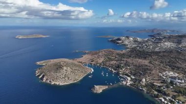 Breathtaking View of Gumusluk Bay with Yachts and Nearby Greek Islands