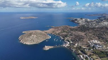 Breathtaking View of Gumusluk Bay with Yachts and Nearby Greek Islands