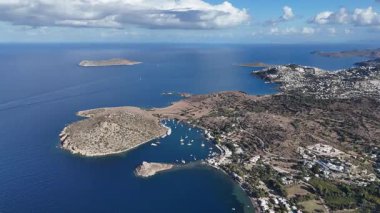 Breathtaking View of Gumusluk Bay with Yachts and Nearby Greek Islands