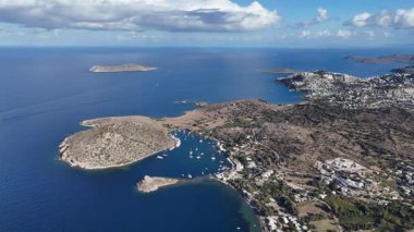 Breathtaking View of Gumusluk Bay with Yachts and Nearby Greek Islands