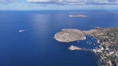 Breathtaking View of Gumusluk Bay with Yachts and Nearby Greek Islands