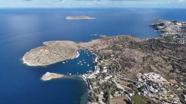 Breathtaking View of Gumusluk Bay with Yachts and Nearby Greek Islands