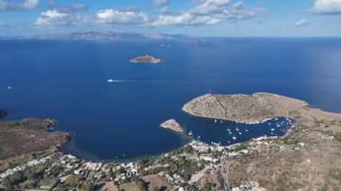 Breathtaking View of Gumusluk Bay with Yachts and Nearby Greek Islands