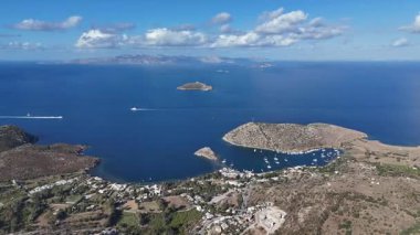 Breathtaking View of Gumusluk Bay with Yachts and Nearby Greek Islands
