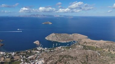 Breathtaking View of Gumusluk Bay with Yachts and Nearby Greek Islands