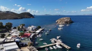Breathtaking View of Gumusluk Bay with Yachts and Nearby Greek Islands