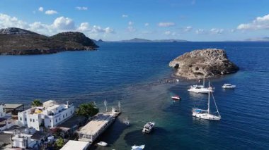 Breathtaking View of Gumusluk Bay with Yachts and Nearby Greek Islands