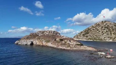 Breathtaking View of Gumusluk Bay with Yachts and Nearby Greek Islands