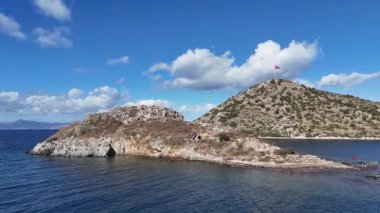 Breathtaking View of Gumusluk Bay with Yachts and Nearby Greek Islands