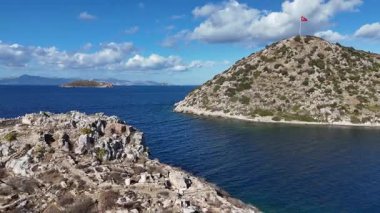 Breathtaking View of Gumusluk Bay with Yachts and Nearby Greek Islands