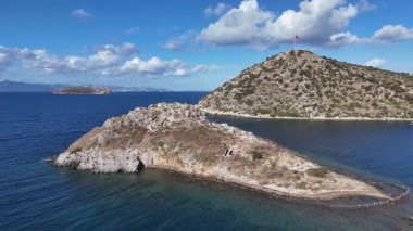 Breathtaking View of Gumusluk Bay with Yachts and Nearby Greek Islands