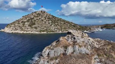 Breathtaking View of Gumusluk Bay with Yachts and Nearby Greek Islands