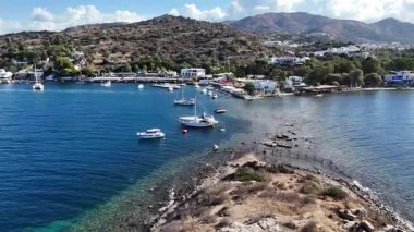 Breathtaking View of Gumusluk Bay with Yachts and Nearby Greek Islands