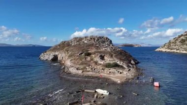 Breathtaking View of Gumusluk Bay with Yachts and Nearby Greek Islands