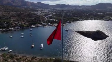 Breathtaking View of Gumusluk Bay with Yachts and Nearby Greek Islands