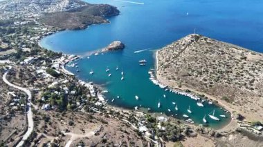 Breathtaking View of Gumusluk Bay with Yachts and Nearby Greek Islands