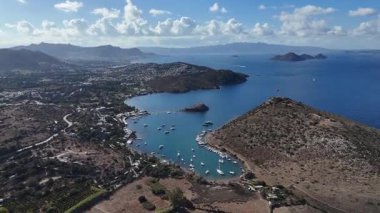 Breathtaking View of Gumusluk Bay with Yachts and Nearby Greek Islands