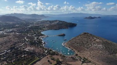 Breathtaking View of Gumusluk Bay with Yachts and Nearby Greek Islands
