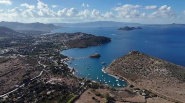 Breathtaking View of Gumusluk Bay with Yachts and Nearby Greek Islands