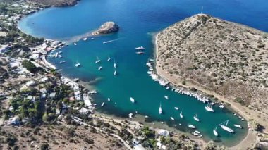 Breathtaking View of Gumusluk Bay with Yachts and Nearby Greek Islands