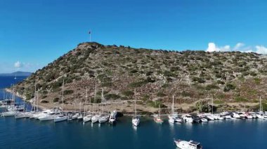 Breathtaking View of Gumusluk Bay with Yachts and Nearby Greek Islands