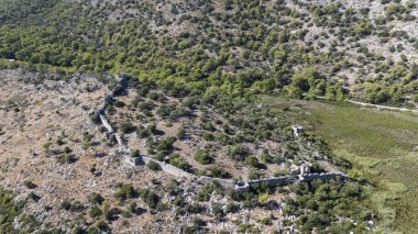 Ancient Ruins of Pyandai on Hillside Landscape