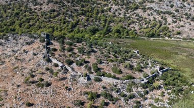 Ancient Ruins of Pyandai on Hillside Landscape
