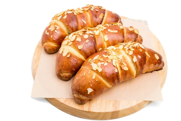 Delicious croissants with grated almonds. — Stock Photo, Image