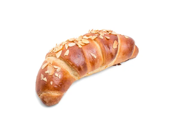 Croissant with grated almonds. — Stock Photo, Image