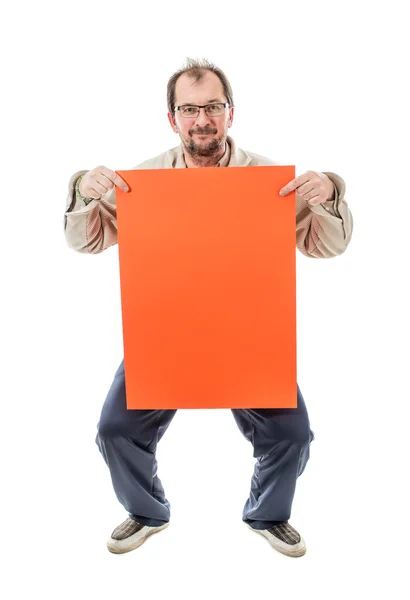 Man holding orange cardboard sheet. — Stock Photo, Image