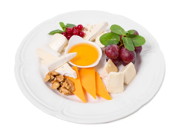 Delicious cheese platter with walnuts and honey. — Stock Photo, Image