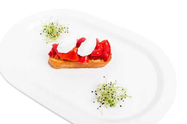 Bruschetta with stewed peppers and mascarpone cheese. — Stock Photo, Image