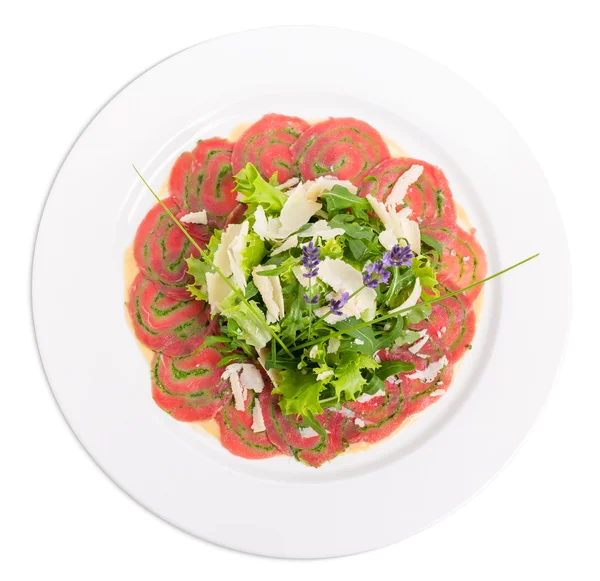 Veal carpaccio with fresh herbs and parmesan. — Stock Photo, Image